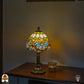 Verlichte Tiffany lamp tafellamp Lucette ⌀20 cm in interieur – crème koepelkap met groene sierband, libellemotief, bronzen kolomvoet