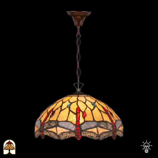 Suspension Tiffany Libelle allumée sur chaîne en bronze avec rosace de plafond, abat-jour en dôme jaune ambré avec accents rouges en forme de goutte et accents ronds bleus en vitrail, motifs de libellules le long du bord, fond sombre