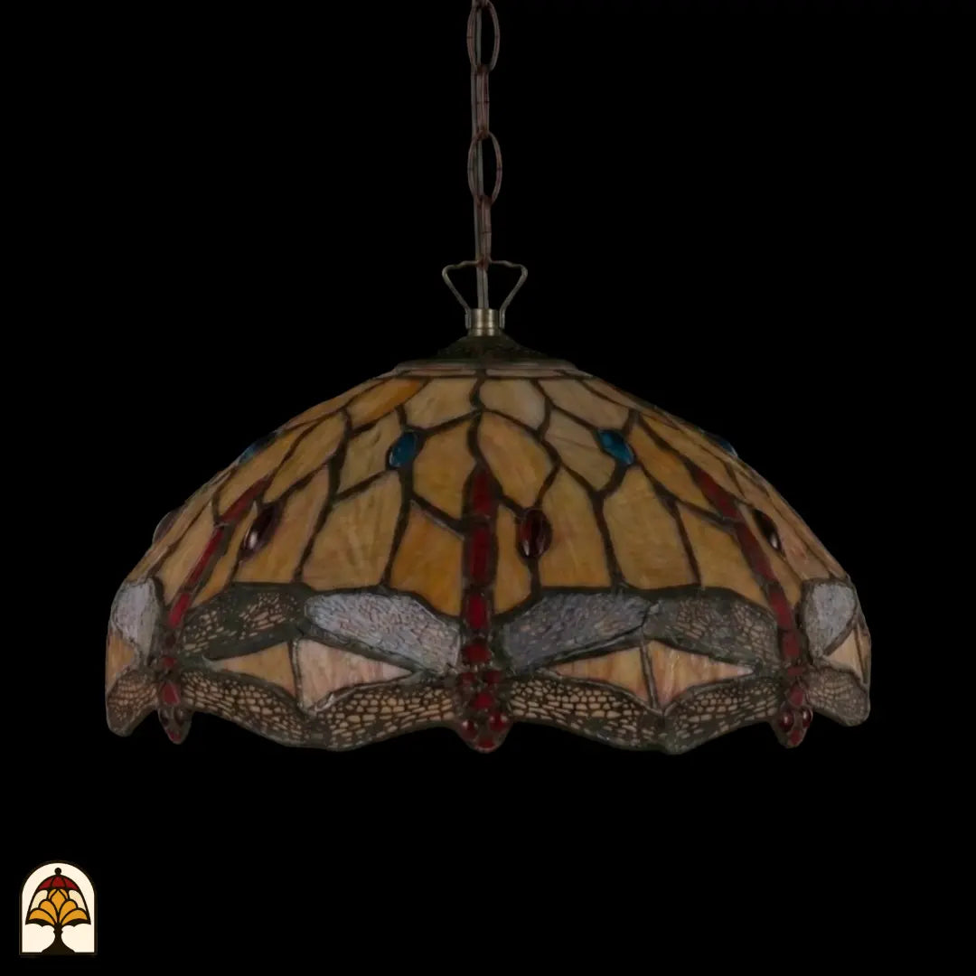 Suspension Tiffany Libelle éteinte à chaîne en bronze, abat-jour en dôme jaune ambré avec motifs de libellules le long du bord, fond sombre