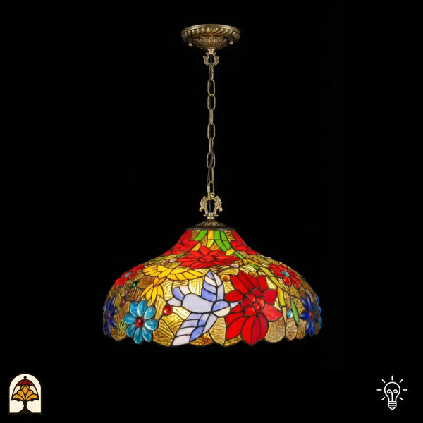 Suspension Tiffany allumée avec abat-jour en vitrail en dôme, fleurs de poinsettia rouges, marguerites bleues, motif de papillon blanc-lavande et panneaux de feuilles jaunes sur fond doré, bord festonné, suspendue à une chaîne en bronze avec rosace de plafond ornée