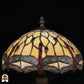 Close-up onverlichte kap Tiffany tafellamp Libelle Elegance, geel-amber glas-in-lood met rode druppels, blauwe accenten en libellenmotieven