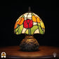 Tiffany tafellamp Holland Golden Tulip ⌀20 cm verlicht – bolvormige kap met rode tulp, oranje tulpen en groene bladeren op libellenvoetstuk